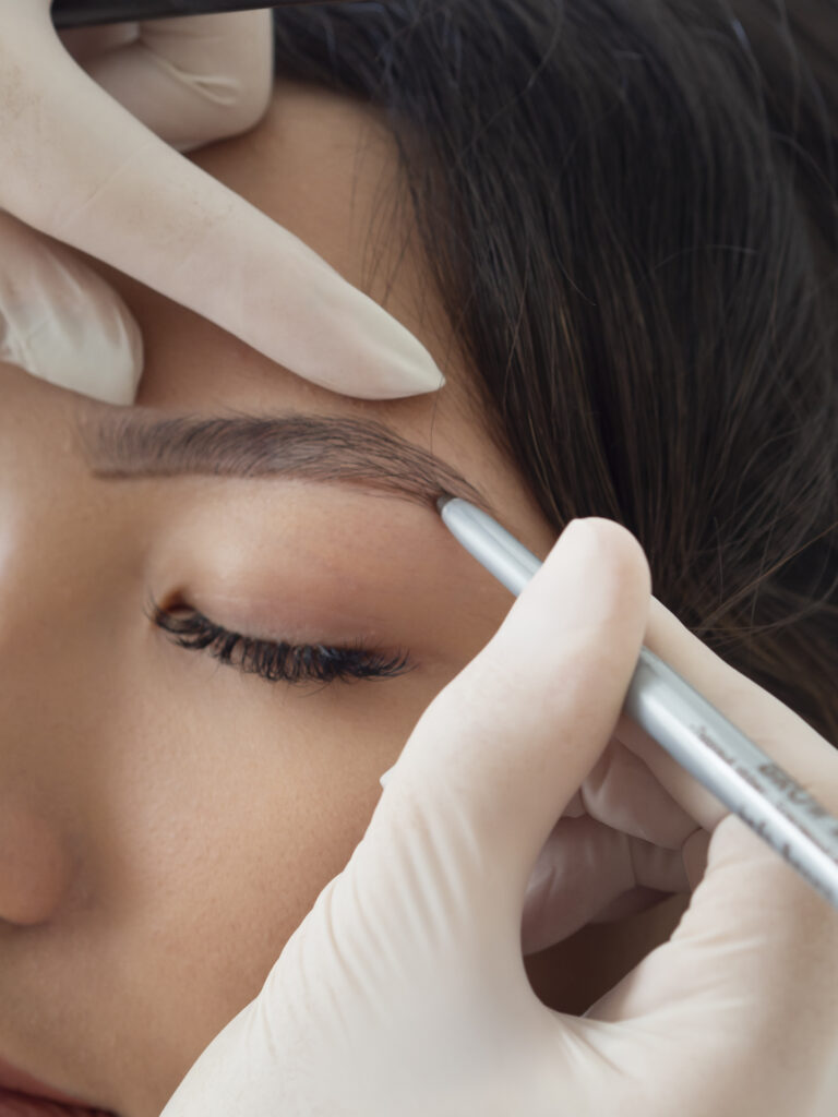 beautician doing microblading treatment client s eyebrows 1